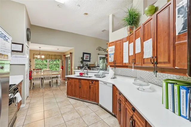 a kitchen with a sink and a large window