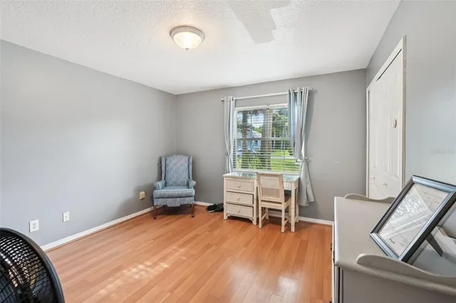 a room with a chair and wooden floor
