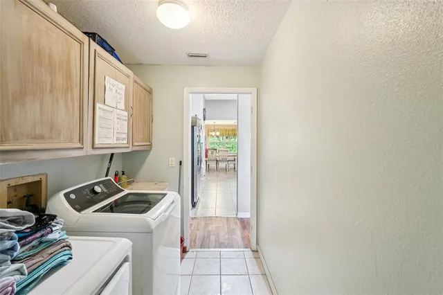 a room that has a sink and a window in it