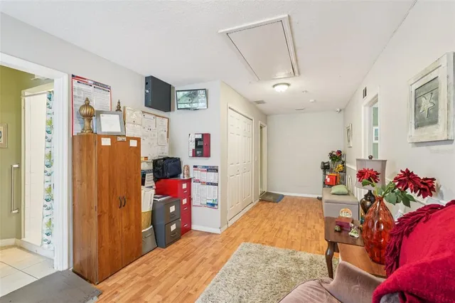 a white toilet sitting next to a bathroom sink and a mirror