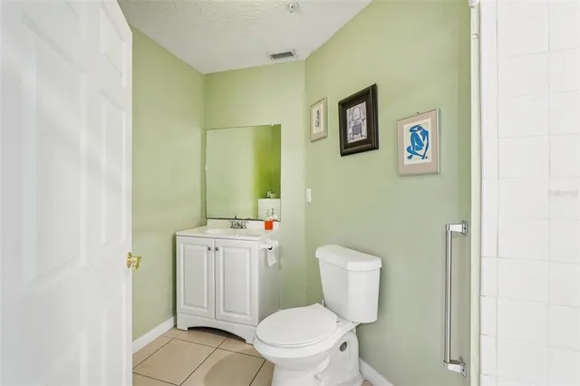 a bed room with a bed and a chair