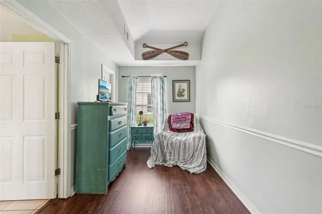 a bathroom with a sink mirror vanity and toilet