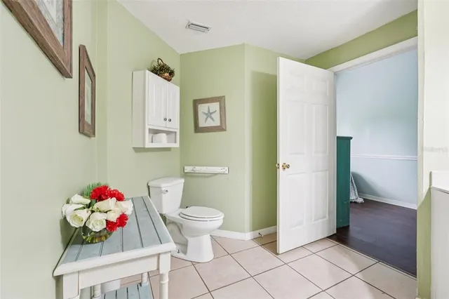 a dining room with furniture and a chandelier