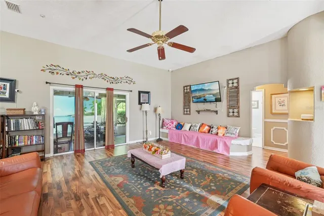 a living room with furniture and large window