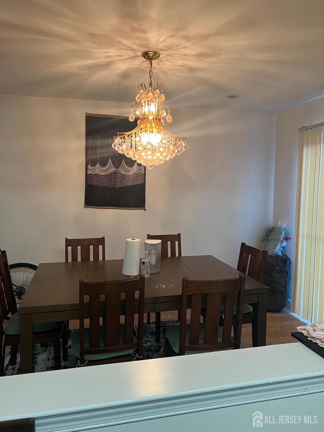 404 Maplecrest Road Edison, NJ 08820 - Photo 3 of 8 a view of a dining room with furniture and chandelier