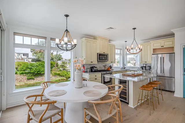 a view of a dining room with furniture window and outside view