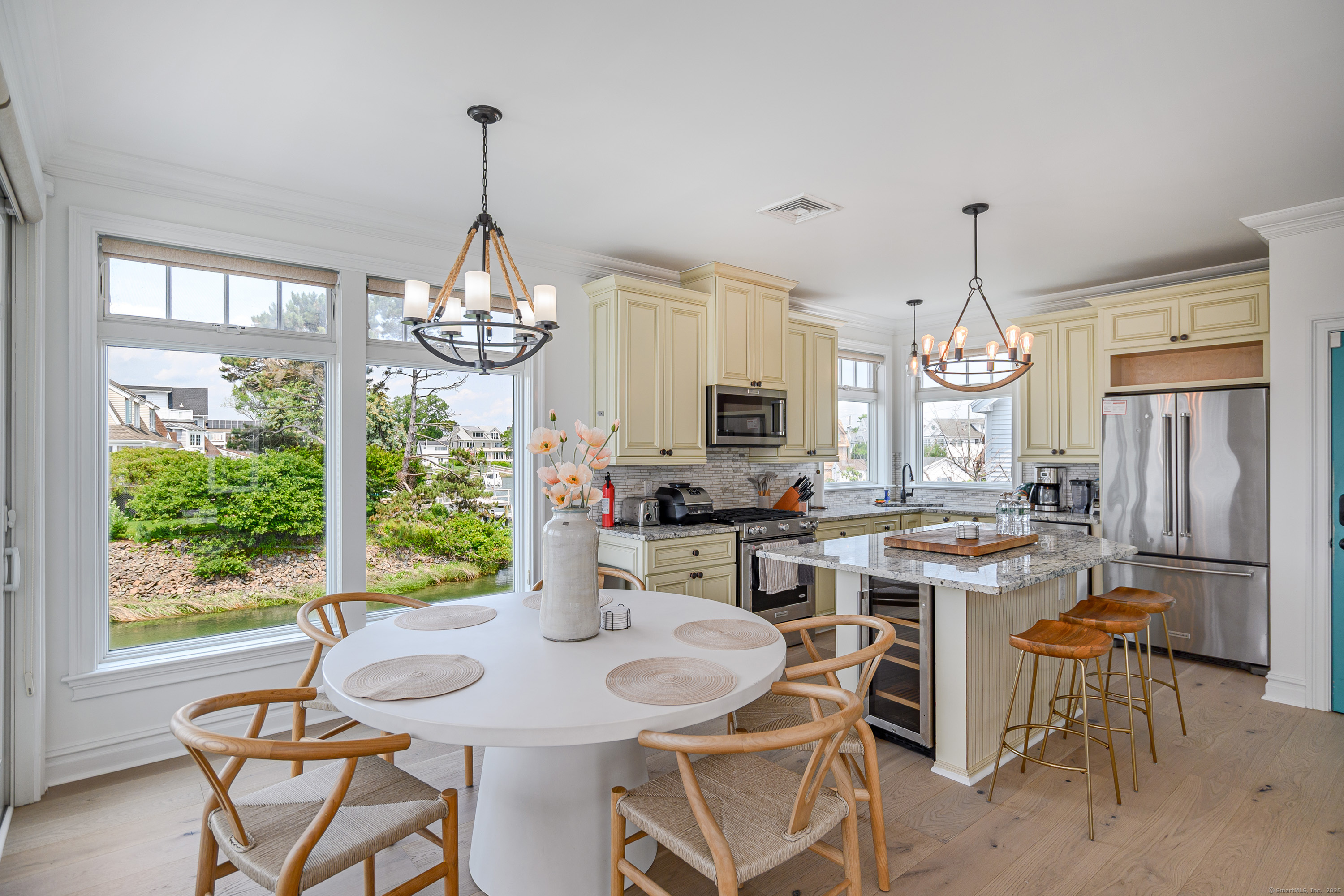 2154 Fairfield Beach Road Fairfield, CT 06824 - Photo 12 of 39 a view of a dining room with furniture window and outside view
