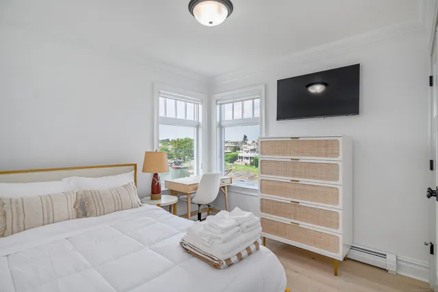 a bathroom with a sink toilet mirror and shower