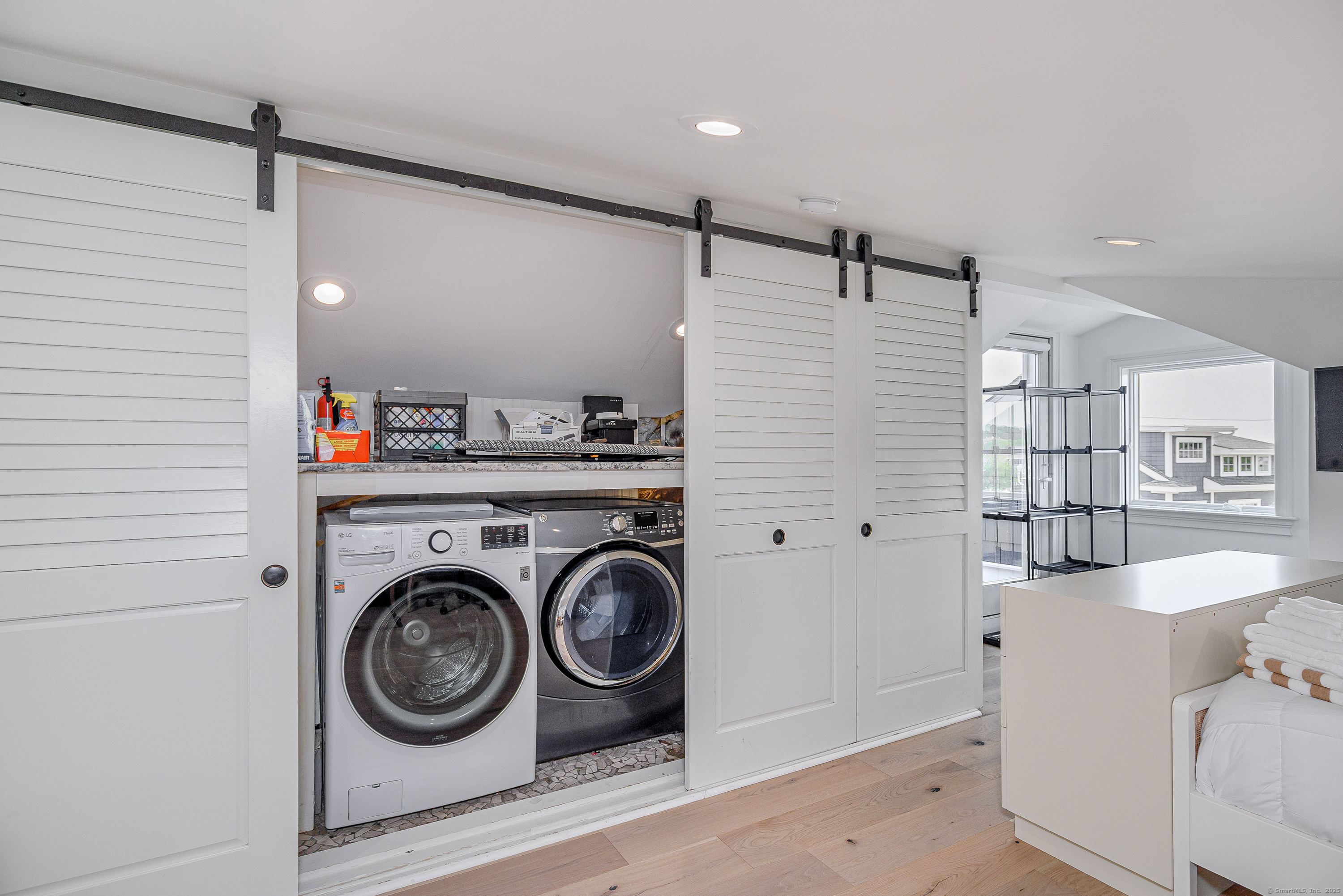 2154 Fairfield Beach Road Fairfield, CT 06824 - Photo 27 of 39 a utility room with dryer and washer