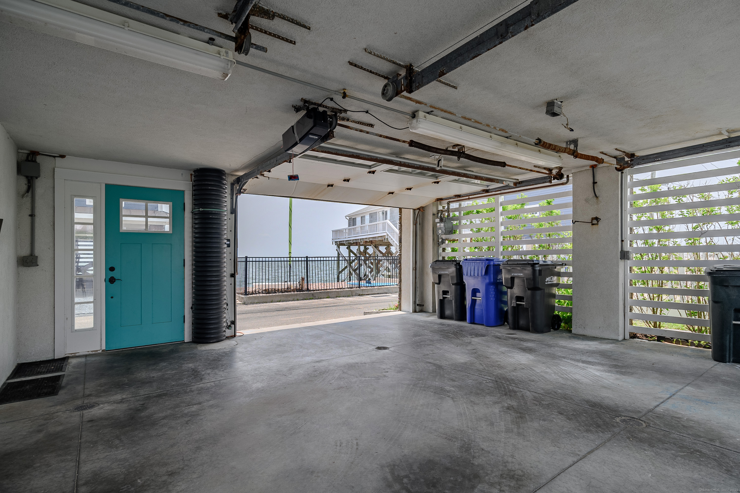 2154 Fairfield Beach Road Fairfield, CT 06824 - Photo 30 of 39 a view of an empty room with a fireplace