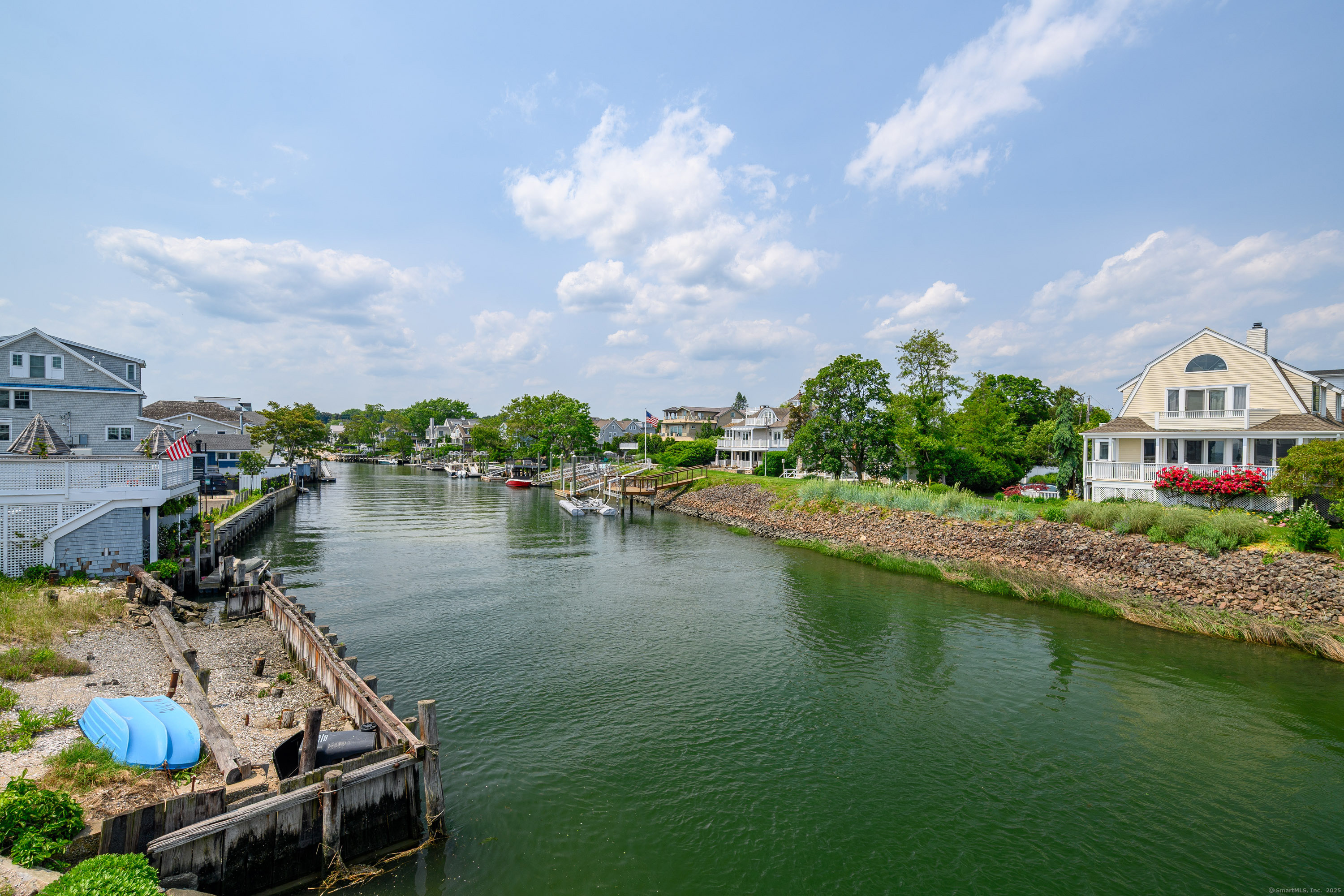 2154 Fairfield Beach Road Fairfield, CT 06824 - Photo 35 of 39 a view of a lake with a house in the background