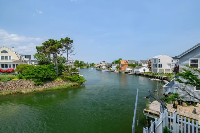 an aerial view of a house with a ocean view