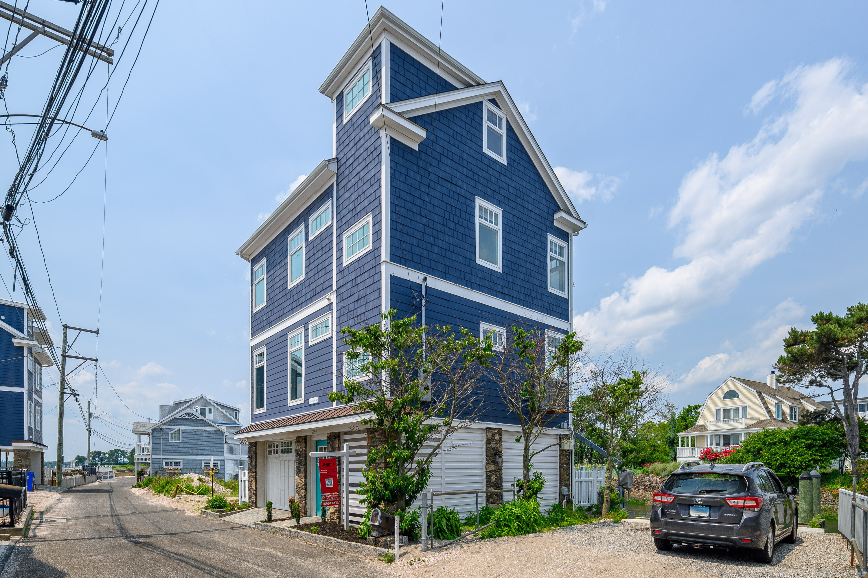 2154 Fairfield Beach Road Fairfield, CT 06824 - Photo 4 of 39 a car parked in front of a building