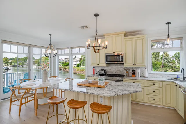 a kitchen with sink cabinets and dining table