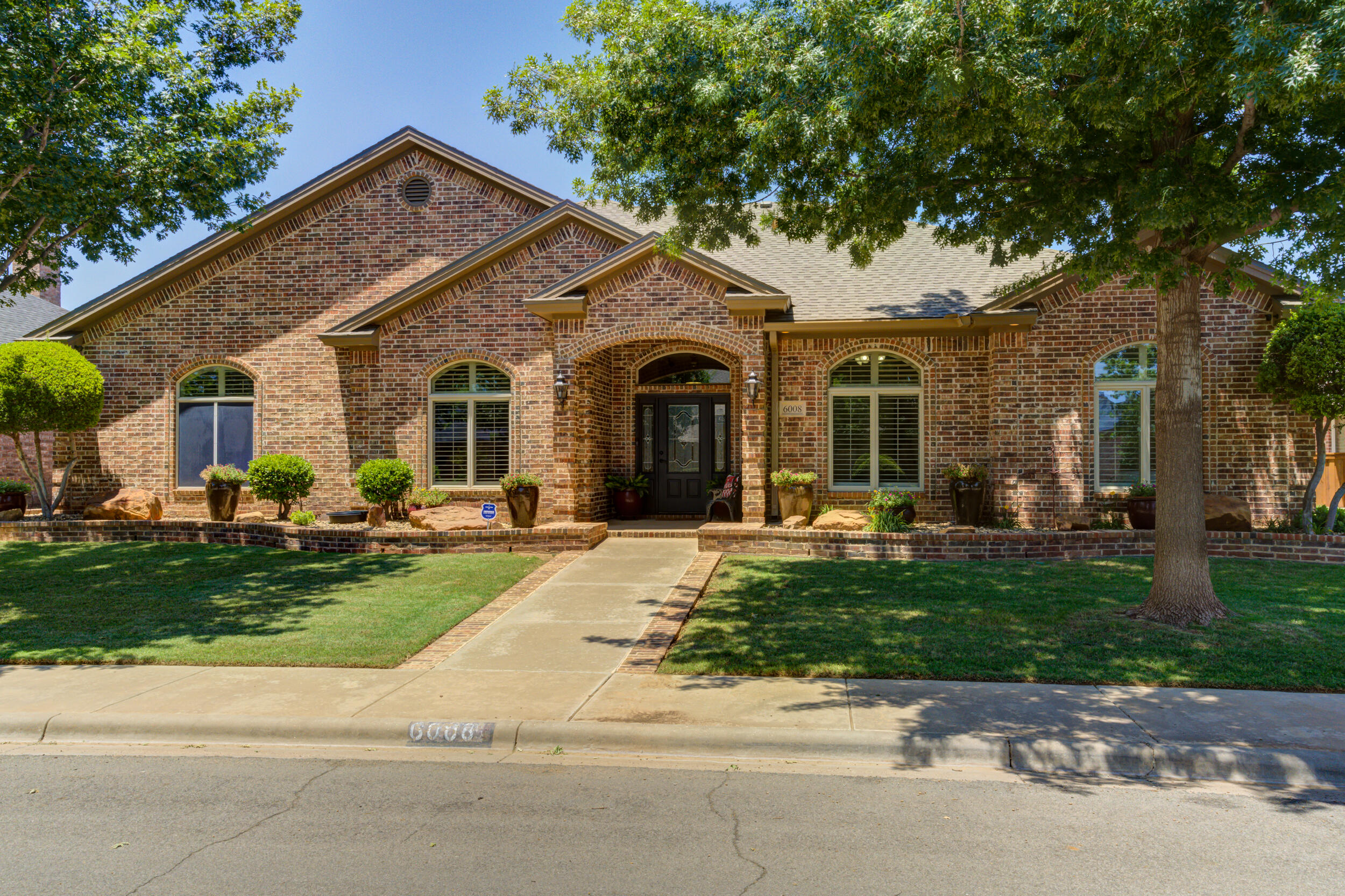 6008 89th Street Lubbock, TX 79424 - Photo 61 of 61 a front view of a house with entertaining space