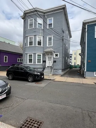 a car parked in front of a building