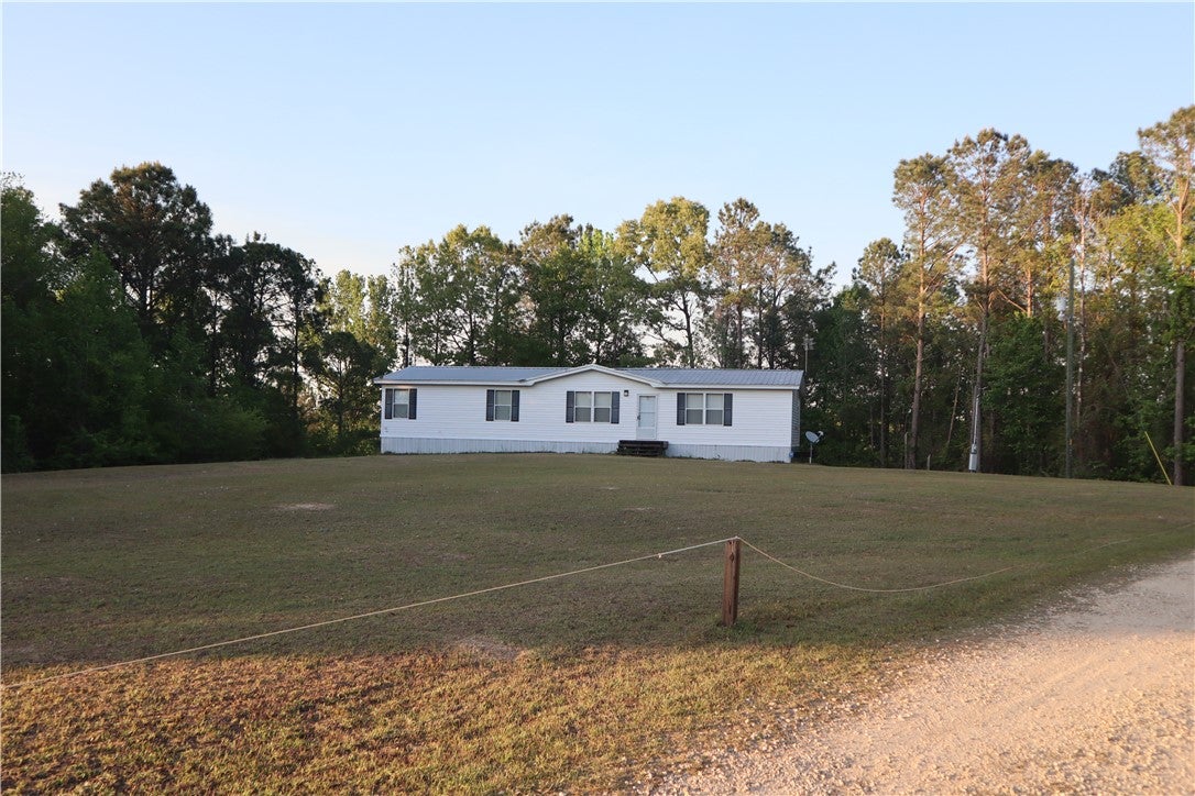 100 Powerline Road Auburn, AL 36830 - Photo 1 of 9 This tranquil setting features a welcoming residence amidst natural surroundings, perfect for peaceful living.