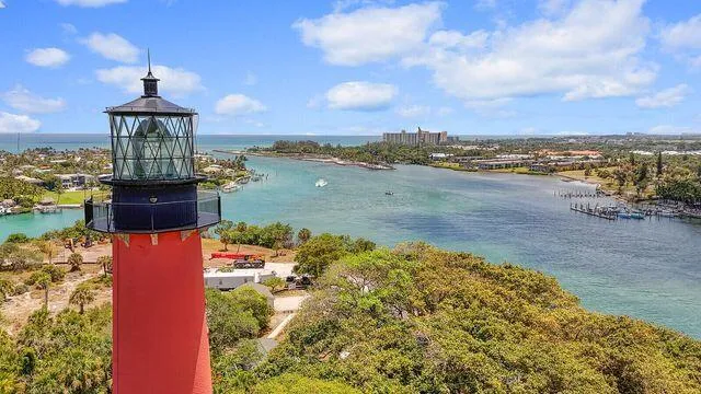 an aerial view of a house with a ocean view