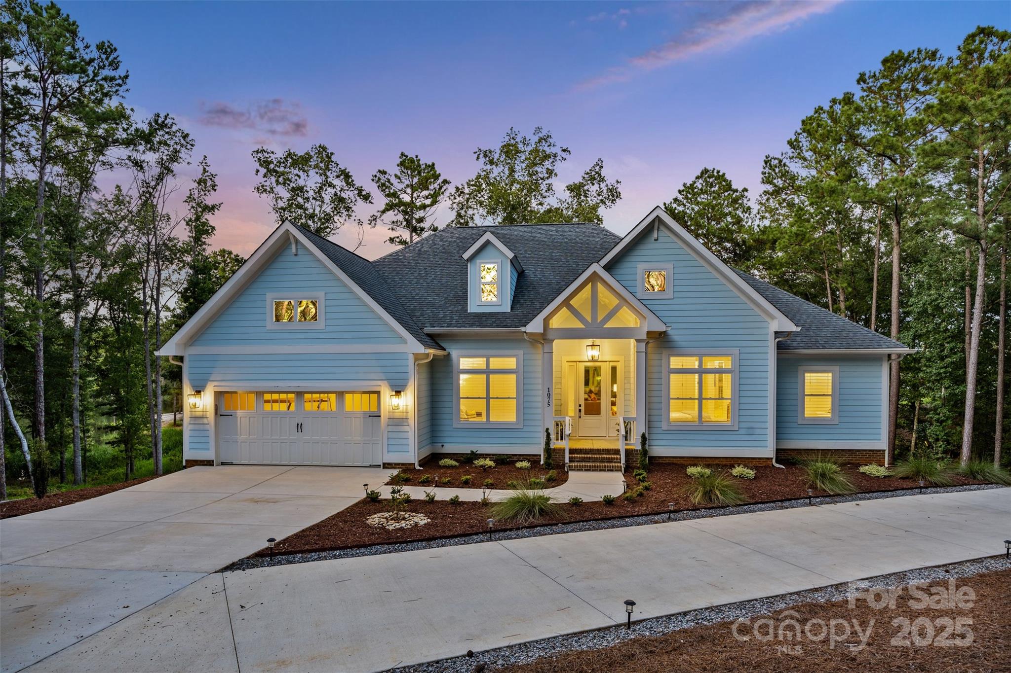 a front view of a house with garden