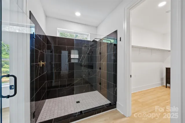 a bathroom with a shower and a sink