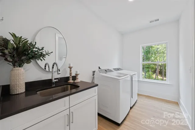 a view of kitchen sink and microwave
