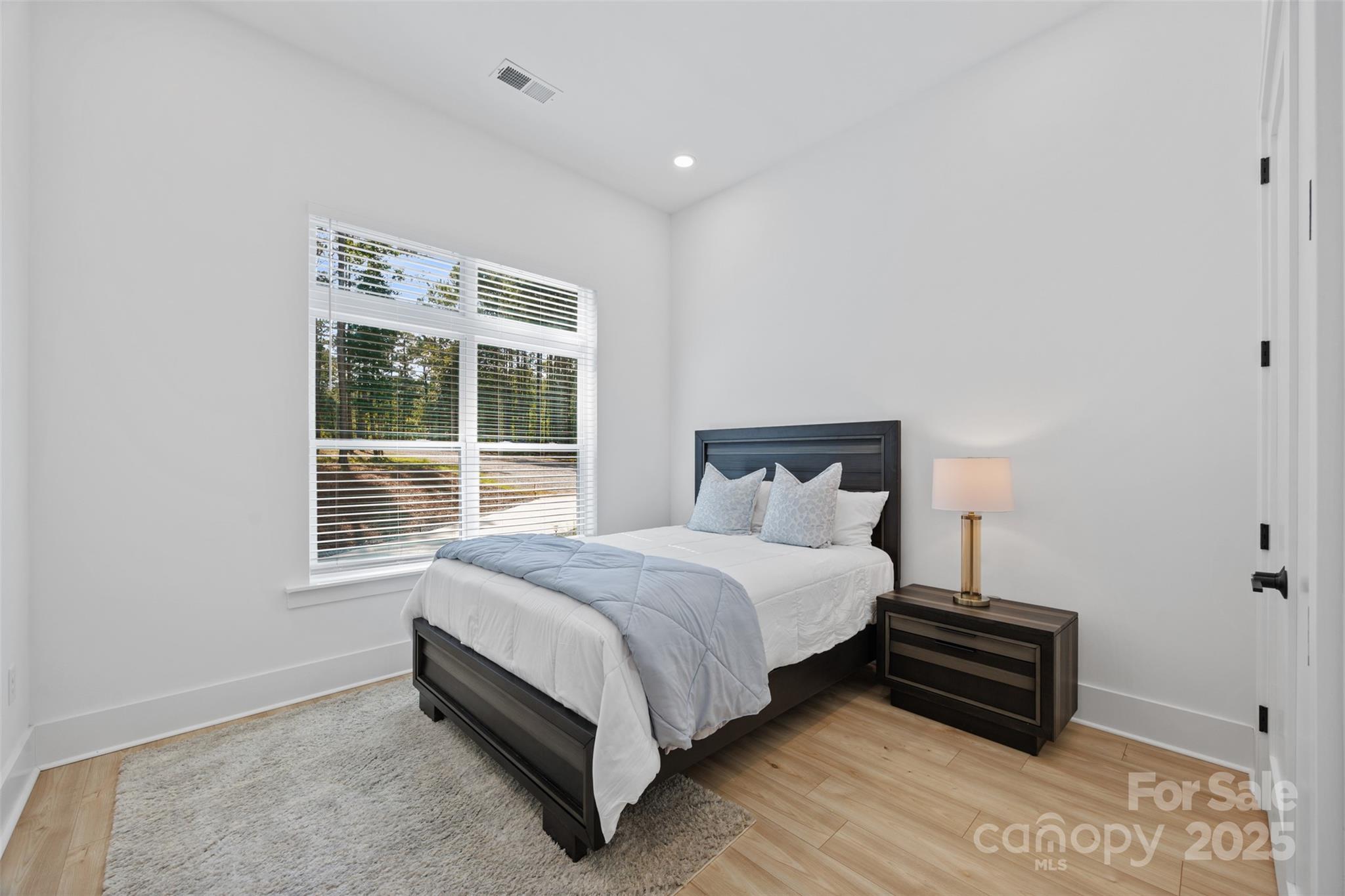 1075 Retreat Way Ridgeway, SC 29130 - Photo 22 of 48 a bedroom with a bed and a window