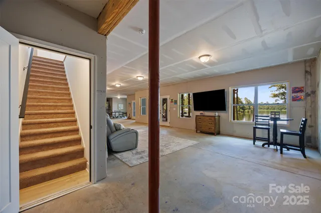 a view of a livingroom with furniture and a window