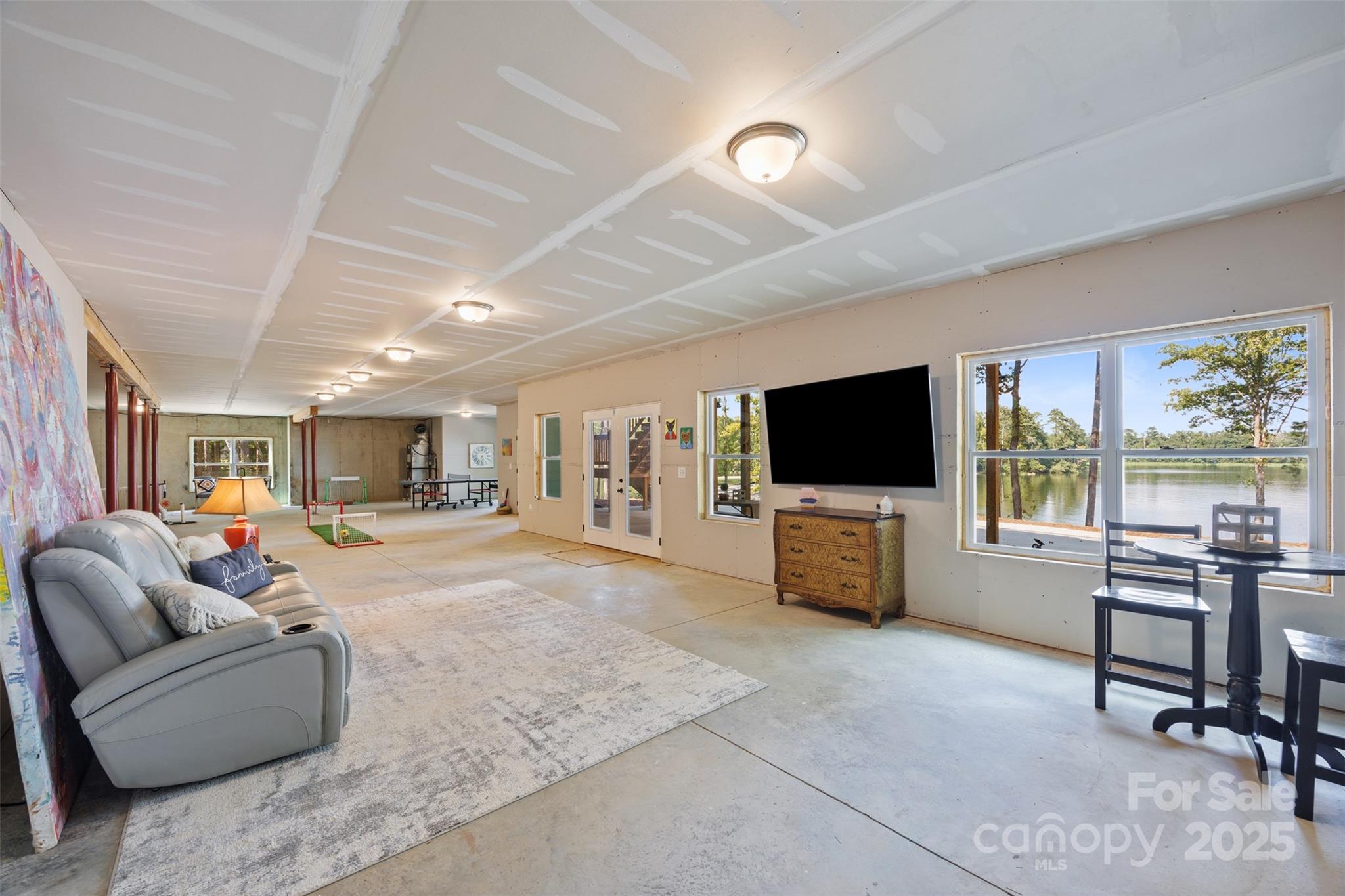 1075 Retreat Way Ridgeway, SC 29130 - Photo 28 of 48 a living room with furniture and a flat screen tv