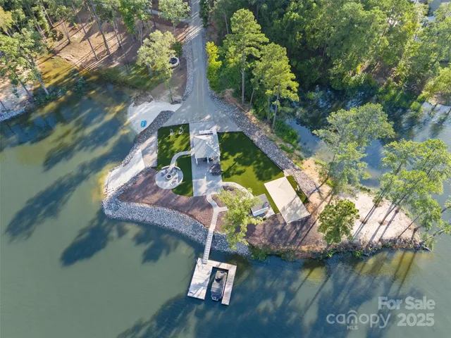 an aerial view of house with yard swimming pool and outdoor seating