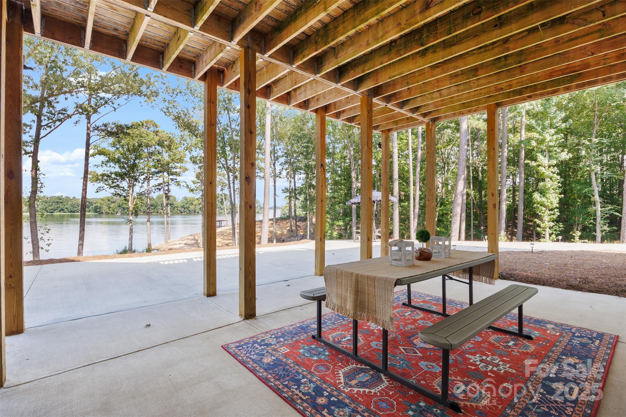1075 Retreat Way Ridgeway, SC 29130 - Photo 33 of 48 a living room with furniture and a floor to ceiling window