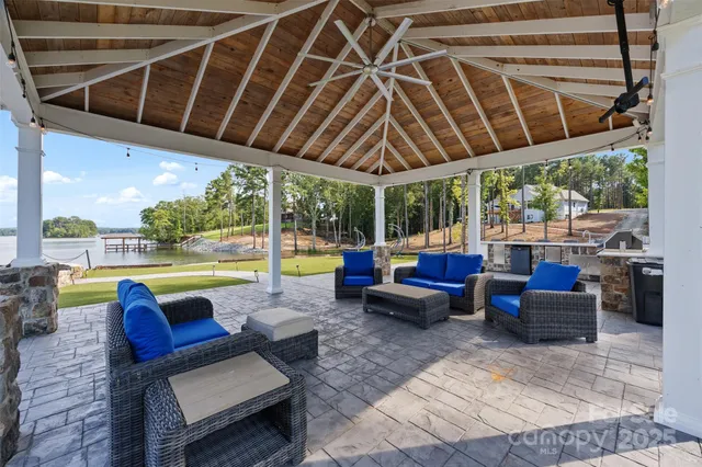 a outdoor space with patio the couches and pool chair with swimming pool view