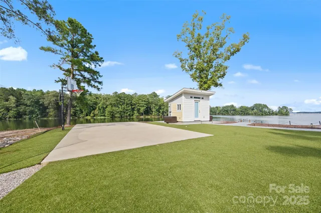 a view of a house with a yard and garage