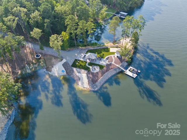 an aerial view of a house with a yard basket ball court