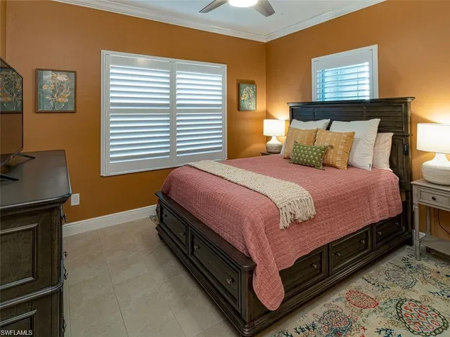 a bedroom with a bed and a night stand