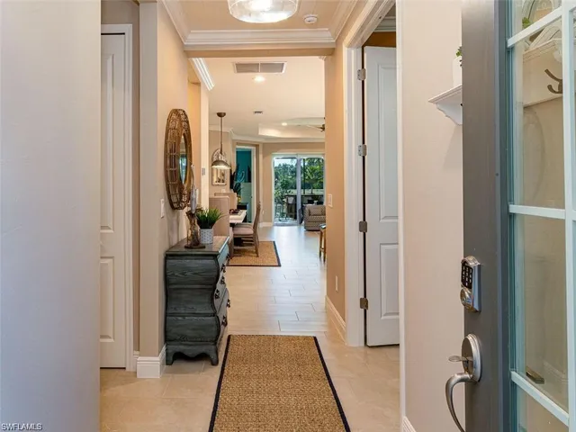 a view of a hallway with living room and furniture