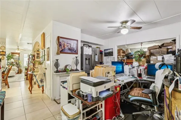 a view of a workspace with furniture and a living room