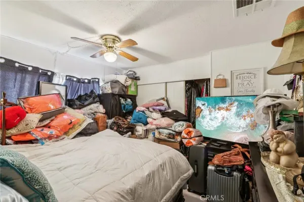 a bedroom with bed and window