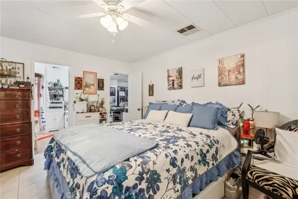a kitchen with stainless steel appliances a chimney a sink and a refrigerator