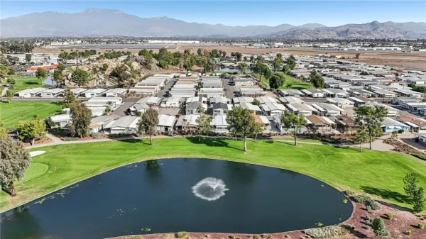 an aerial view of a house with a lake view