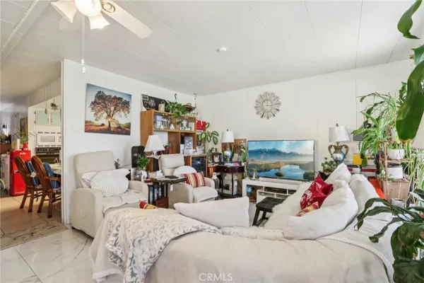 a living room with furniture and flat screen tv