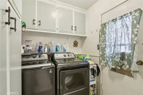 a kitchen with stainless steel appliances a stove a microwave and cabinets