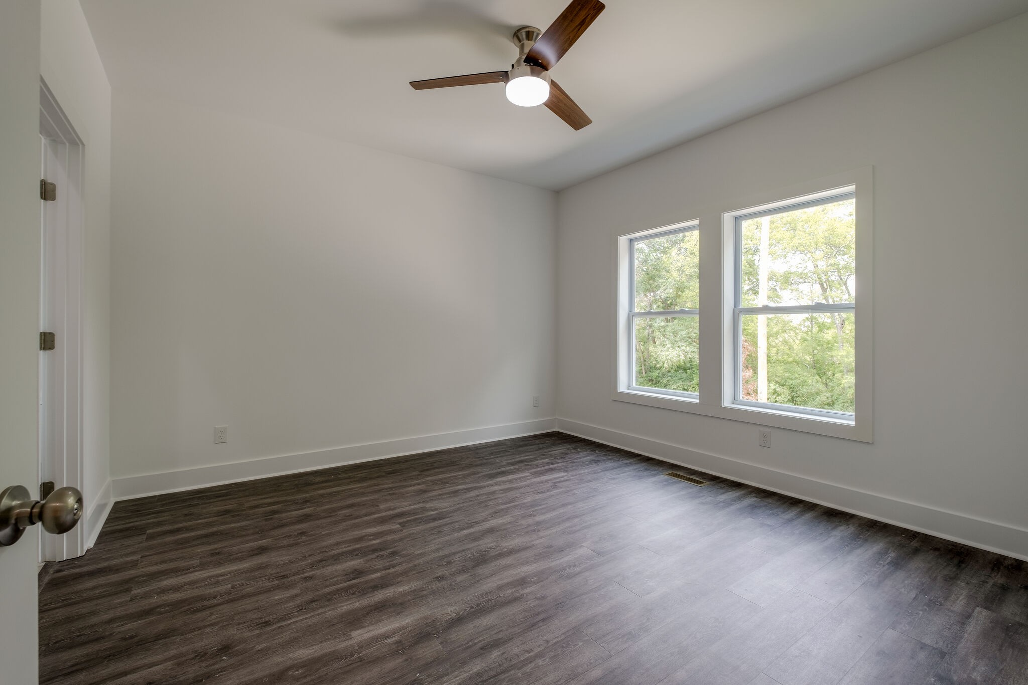 4341 Goins Road Nashville, TN 37211 - Photo 12 of 28 a view of an empty room with wooden floor and a window