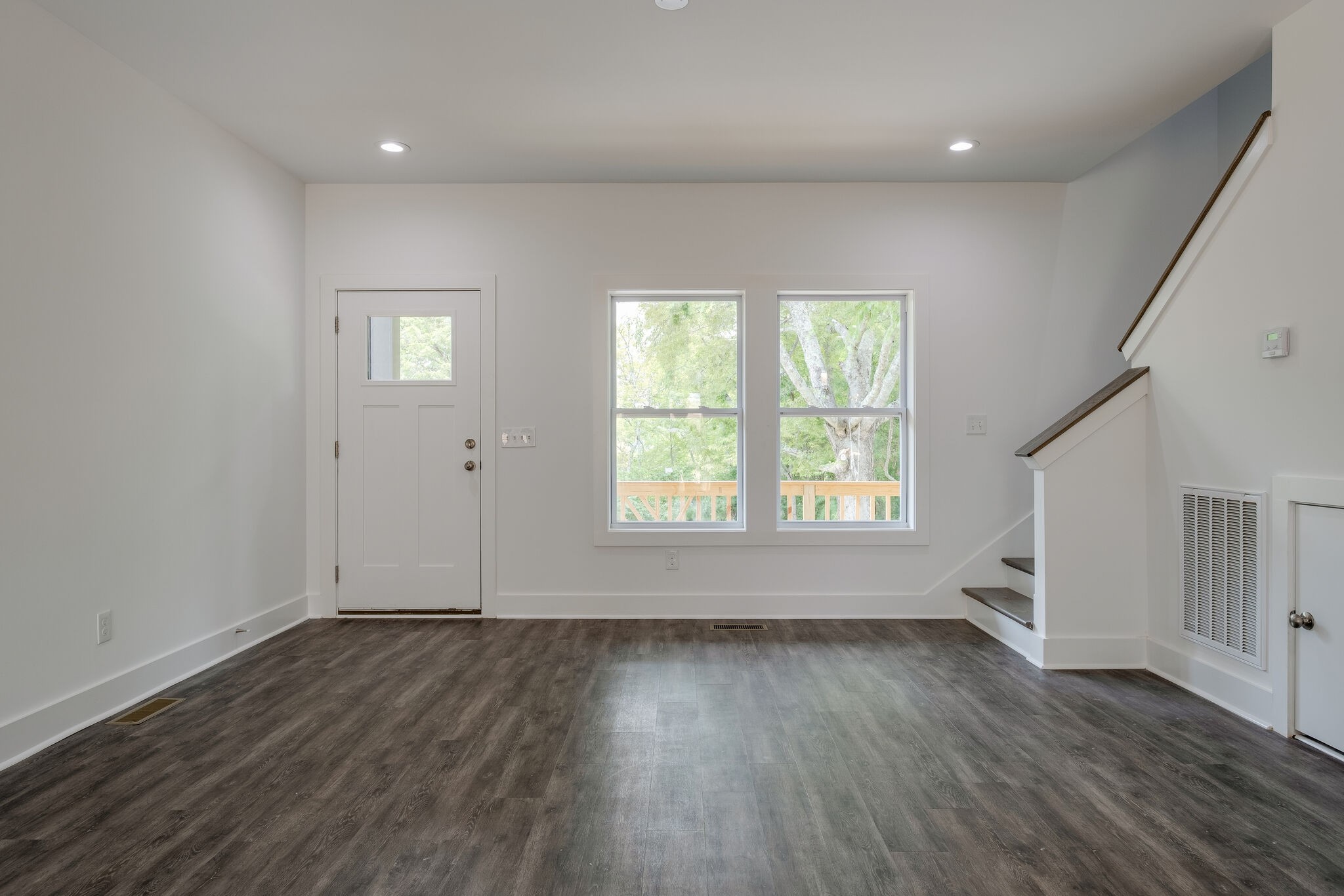 4341 Goins Road Nashville, TN 37211 - Photo 6 of 28 an empty room with wooden floor and windows