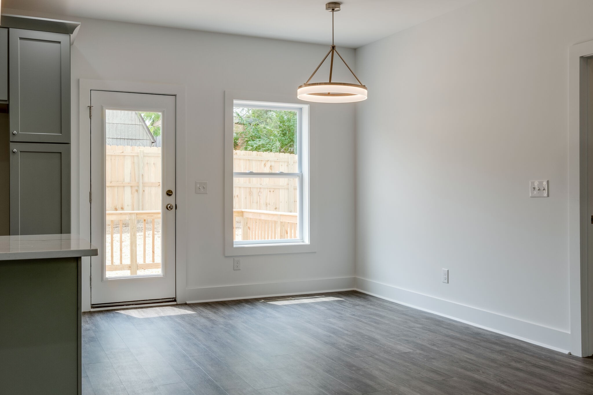 4341 Goins Road Nashville, TN 37211 - Photo 9 of 28 a view of an empty room with wooden floor and a window