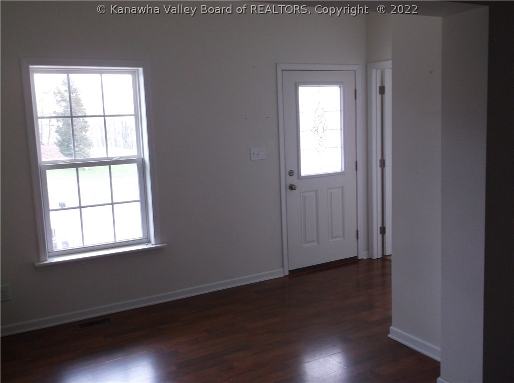 19329 Derricks Creek Road Charleston, WV 25320 - Photo 5 of 19 THE ENTRY PROVIDES IMMEDIATE ACCESS TO A DEN/STUDY/HOME OFFICE. DURABLE ENGINEERED LAMINATE FLOORING SURVIVES FOOT AND/OR PET TRAFFIC BETTER THAN HARDWOOD.