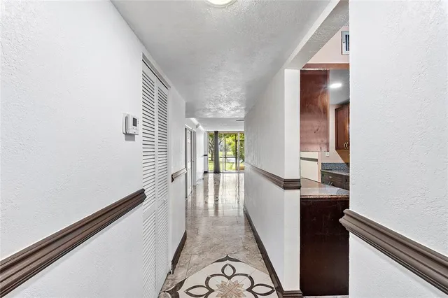 a view of a hallway with windows