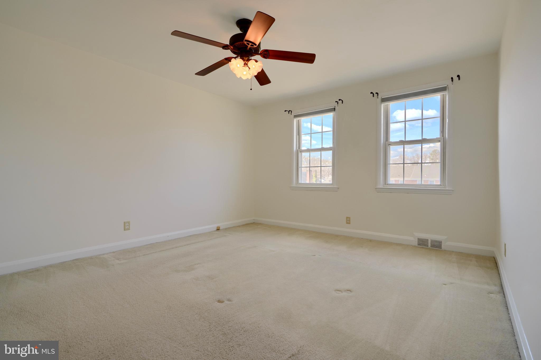 1852 Edgewood Road Towson, MD 21286 - Photo 12 of 31 an empty room with a window and a fan