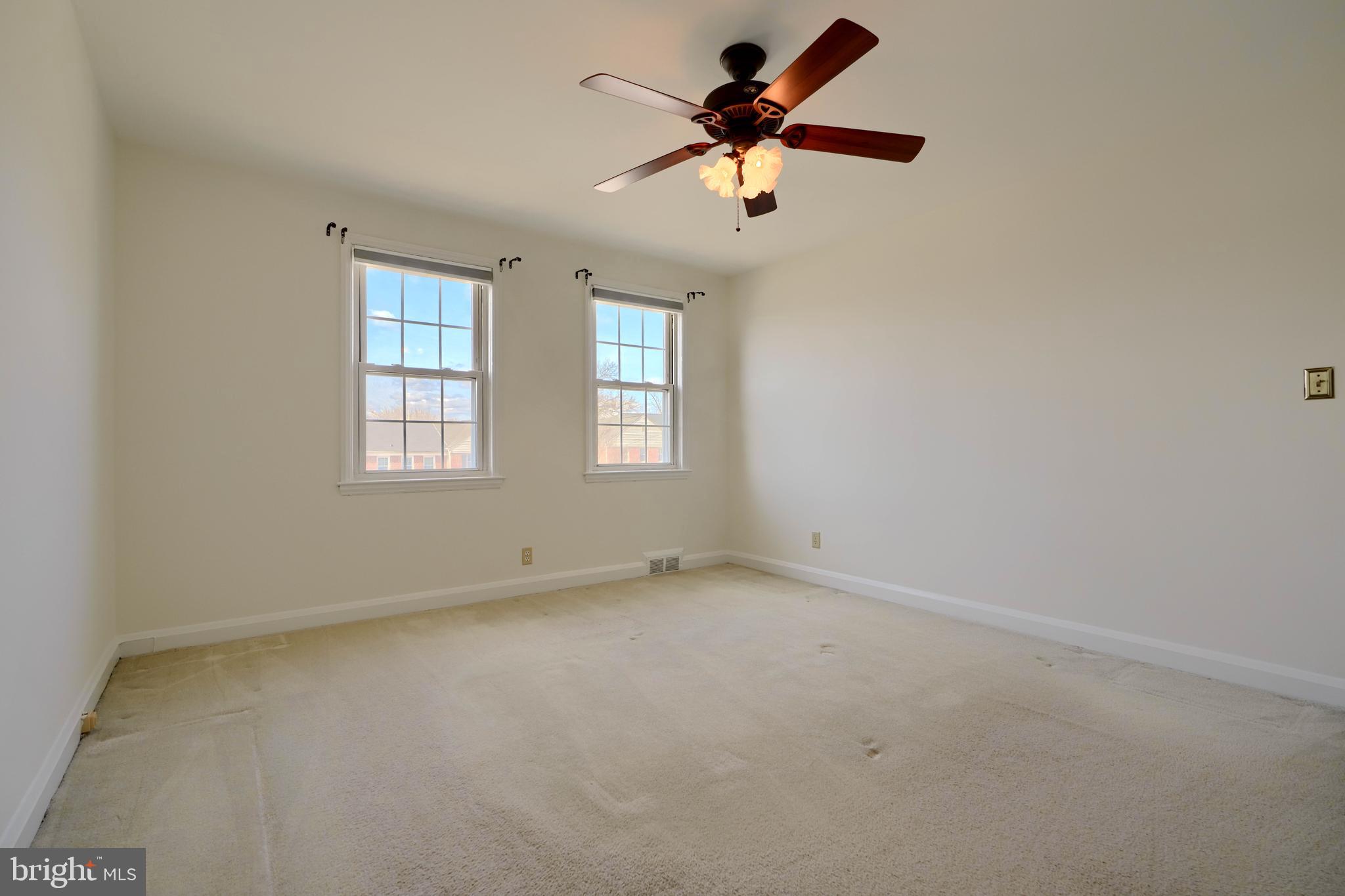 1852 Edgewood Road Towson, MD 21286 - Photo 14 of 31 an empty room with a window and a fan