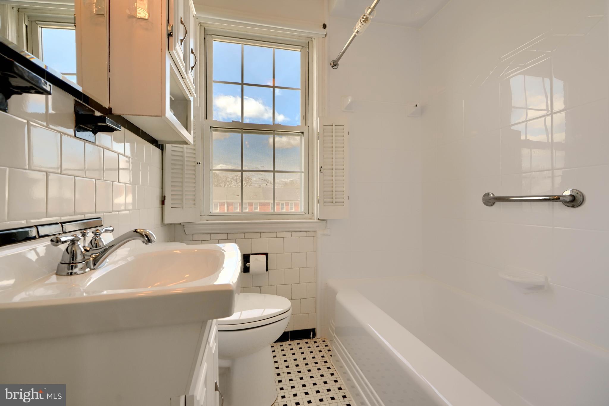 1852 Edgewood Road Towson, MD 21286 - Photo 16 of 31 a bathroom with a sink a toilet and a bathtub
