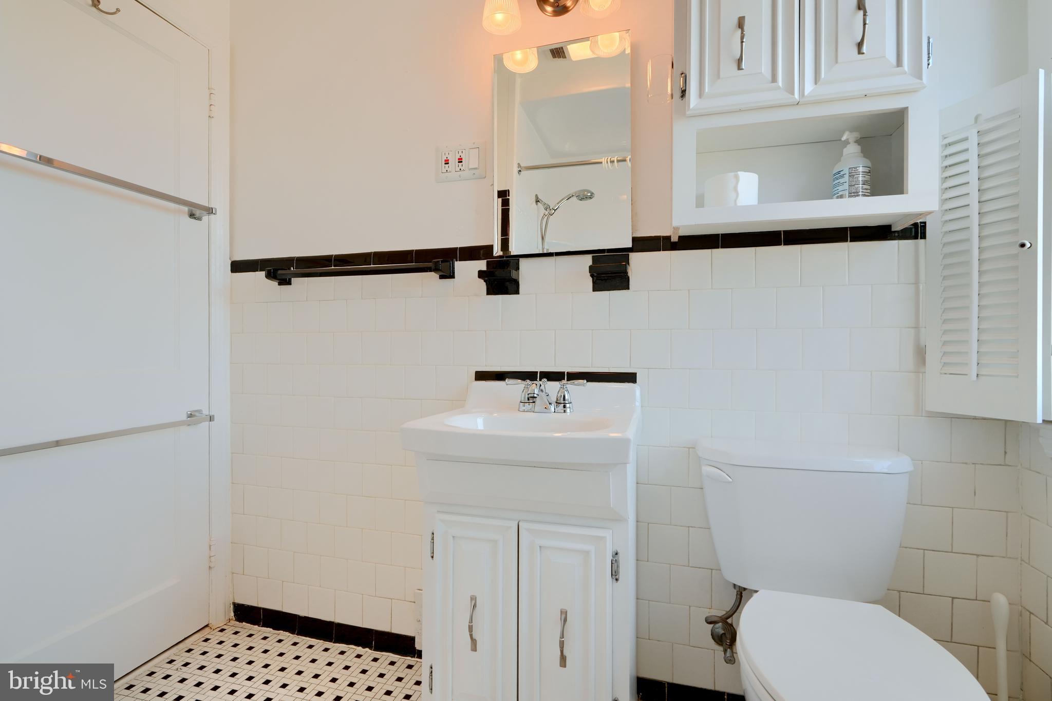 1852 Edgewood Road Towson, MD 21286 - Photo 17 of 31 a bathroom with a sink a toilet and a mirror
